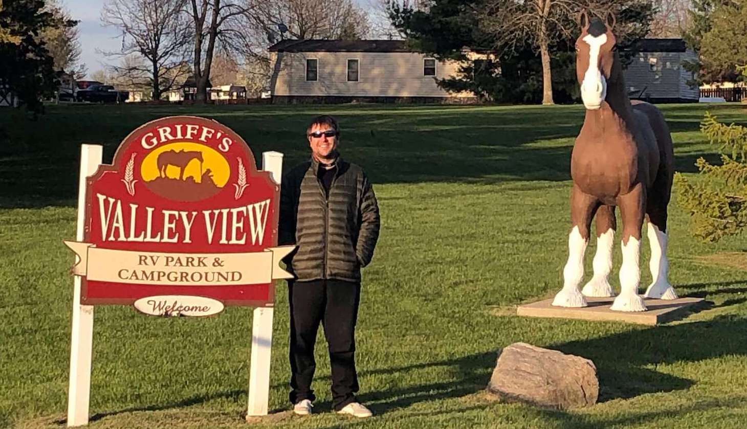 Bryan standing in front of the Griff's sign