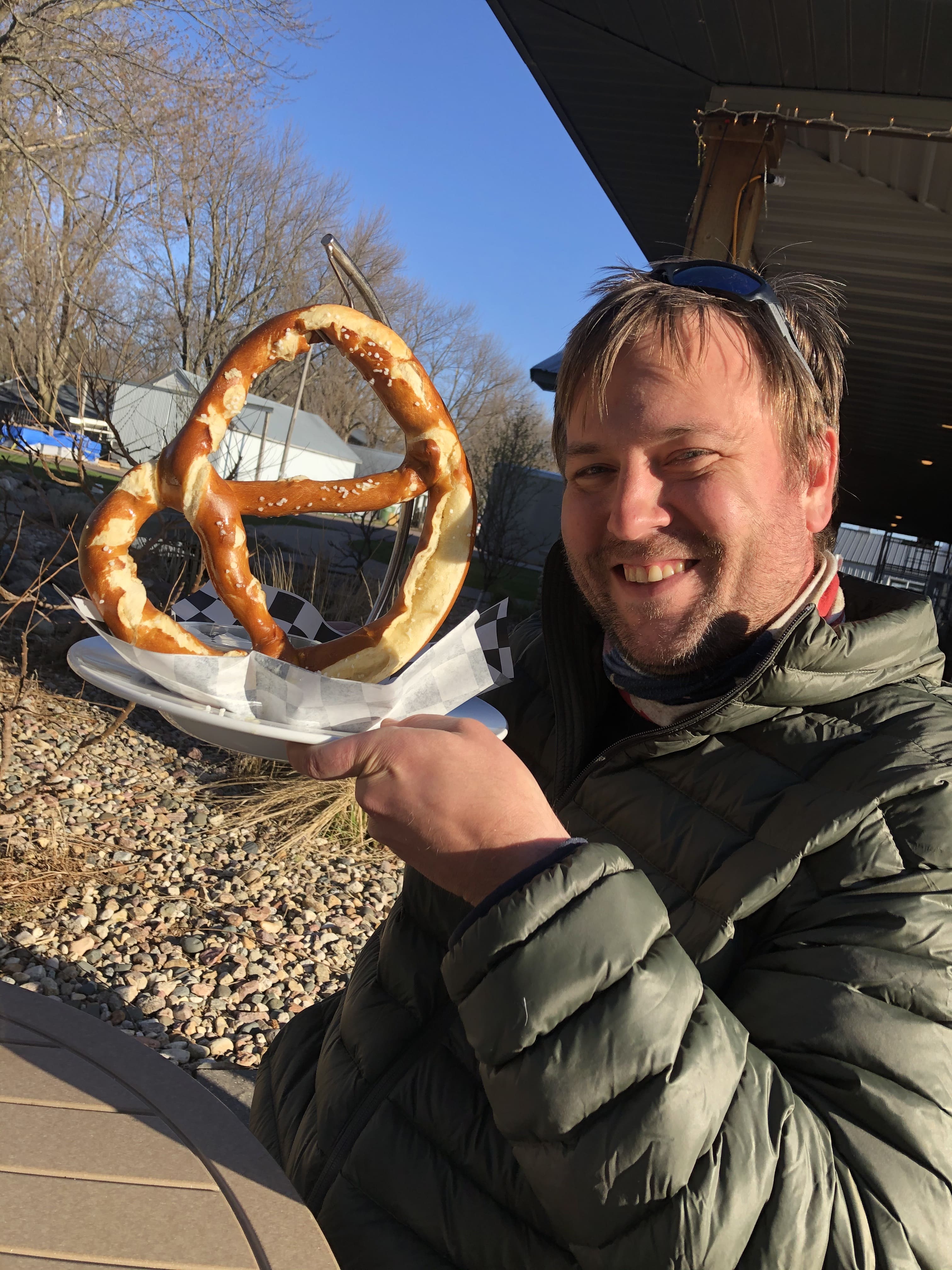Bryan holding up a giant pretzel
