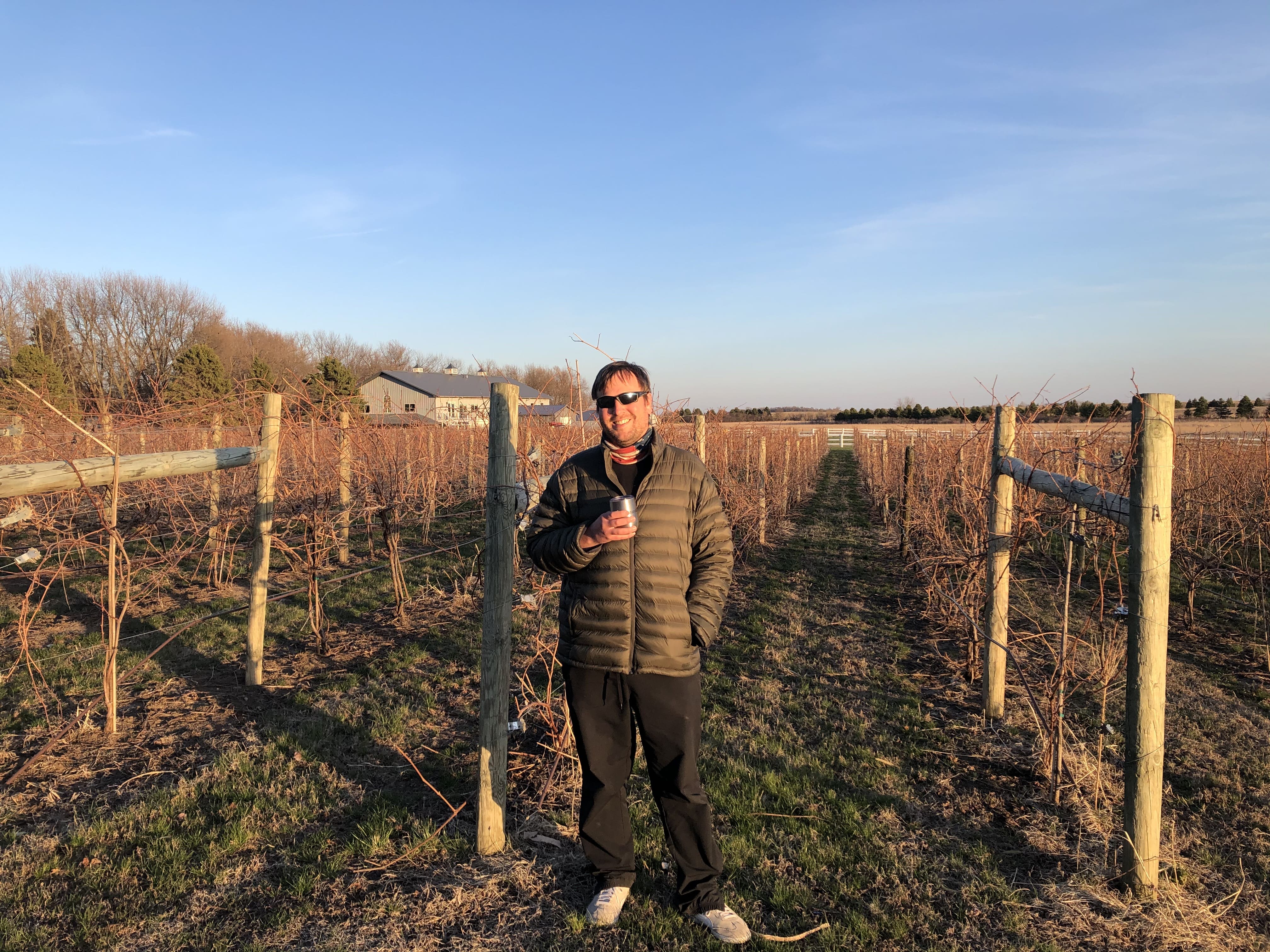 Bryan standing in the vineyards