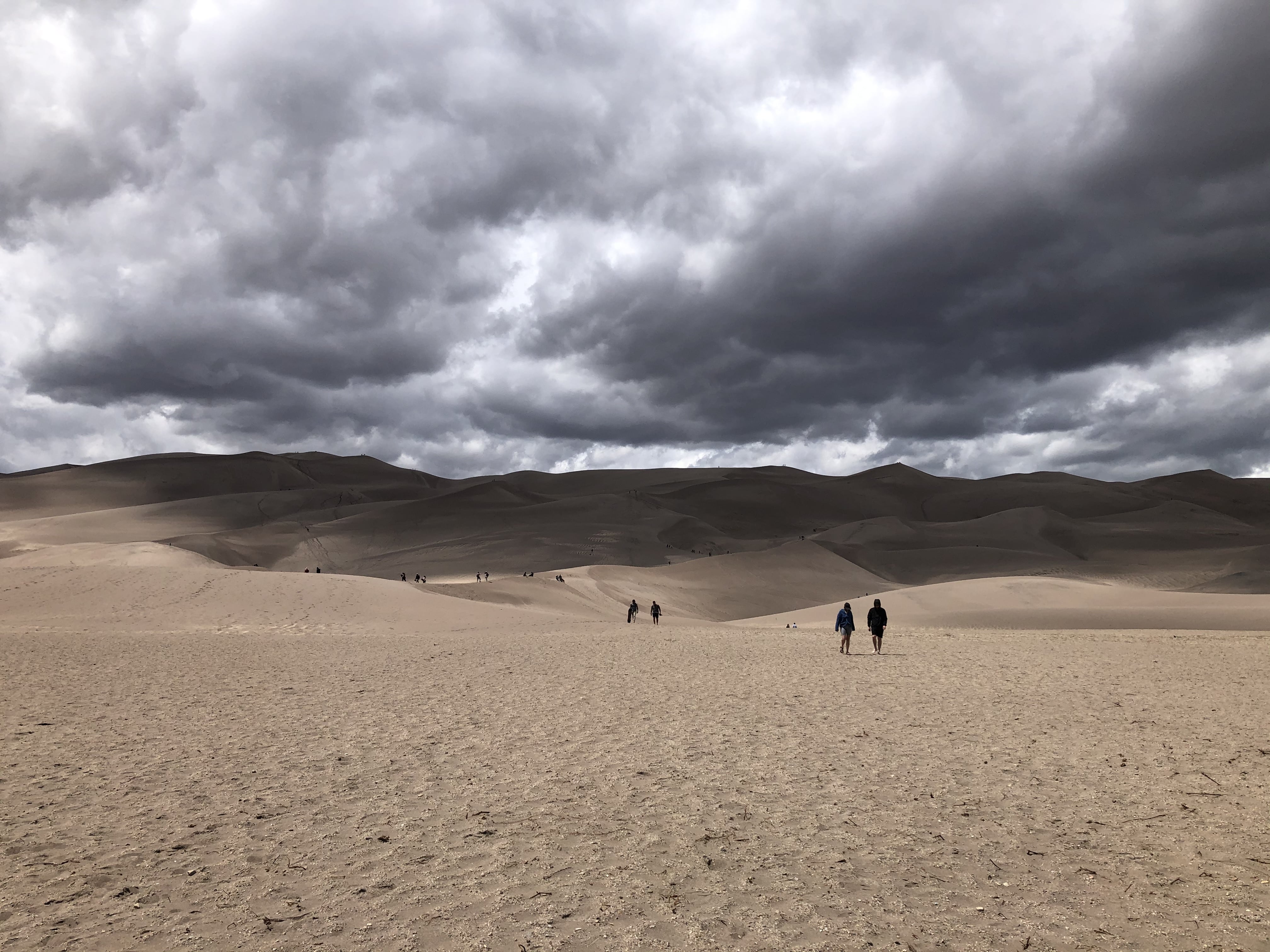 Clouds rolling in over the sand dunes
